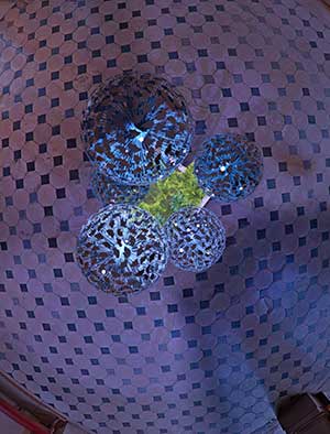 Bespoke allium-like sculpture in the reimagined central vestibule of a famous French Chateau