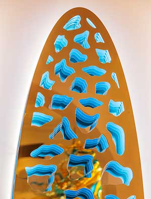 Aegis sculpture spreading light across an alcove