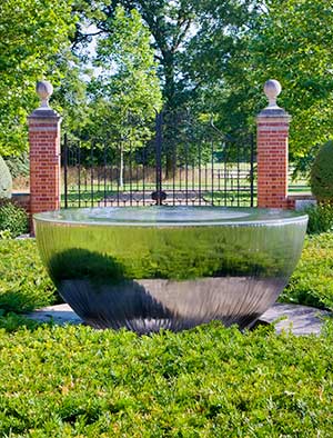 Sky Chalice outdoor water fountain as the centerpiece of a formal garden
