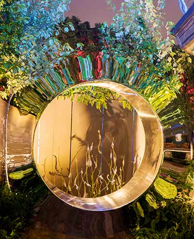 Reflections on Torus sculpture illuminated at night