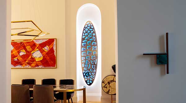 Aegis sculpture with programmable LED lighting in alcove