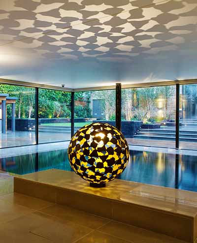 Interior mantle sculpture by an indoor swimming pool