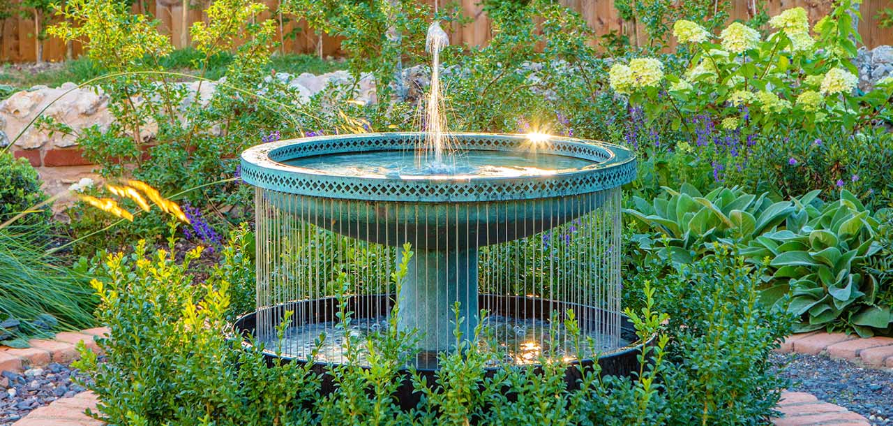 Blue verdigris patination on a Mimeo Cascade water feature