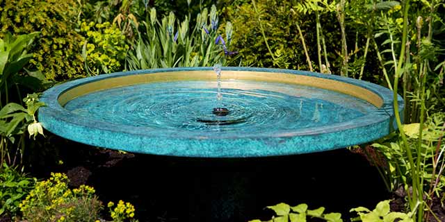 Mimeo water feature nested in planting