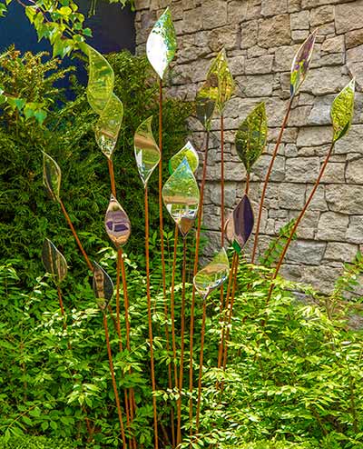 Quiver sculpture in a small garden setting