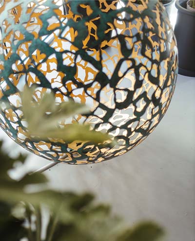 Sinuous patterns of Geminus globe sculpture