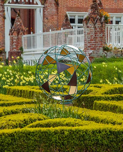 Matrix sculpture at the centre of a parterre at Helmingham Hall
