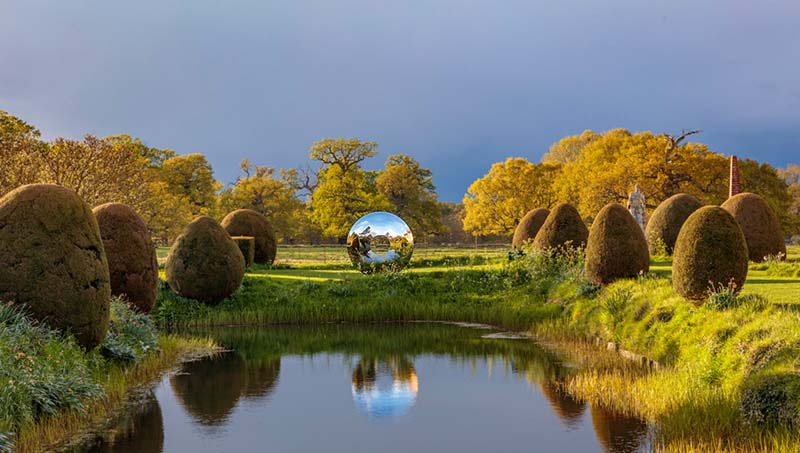Torus sculpture at the end of a lake at Helmingham Hall
