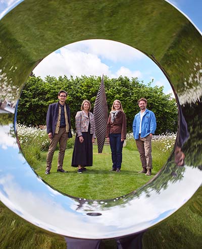 Looking through Torus sculpture to open day speakers