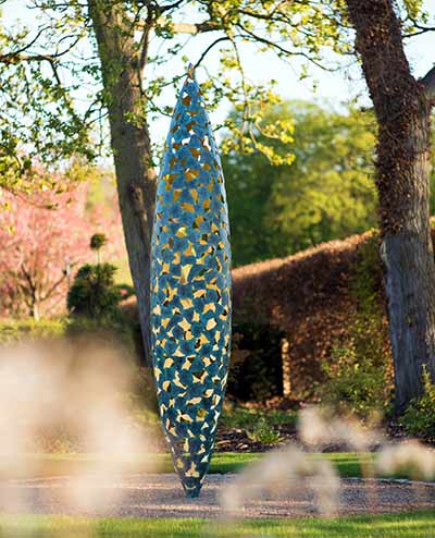 Two Quills in two different metals: verdigris bronze and stainless steel