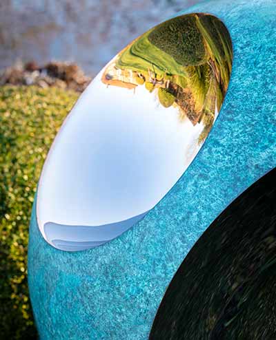 Distorted reflections in a bite out of the Bite sculpture