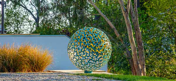 Geminus sculpture in a garden