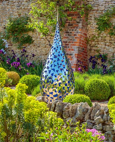 Reflections in the mirror-polished stainless steel petals of the Teardrop Sculpture