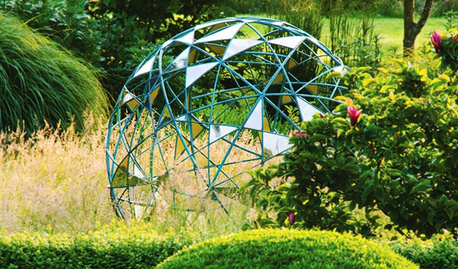 Matrix contemporary sculpture in a pretty garden