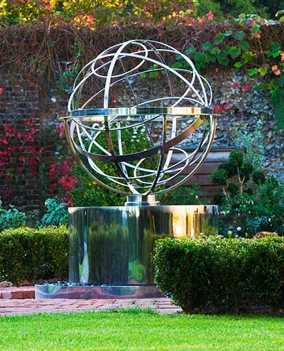 Metal armillary sphere on a plinth
