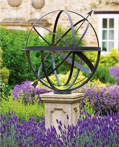 Brass armillary sphere in a beautiful lavender garden