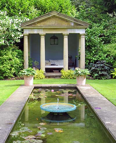 Ekho water feature in a rill leading to a classical building