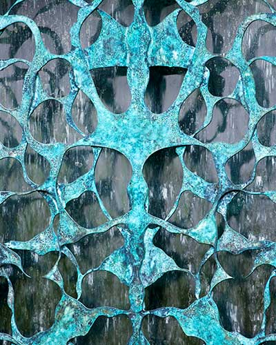 Detail of the verdigris bronze lattice work on the Filigree water wall
