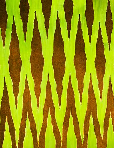 Detail of pattern of reflective stainless steel and rusty mild steel on Interwoven water wall
